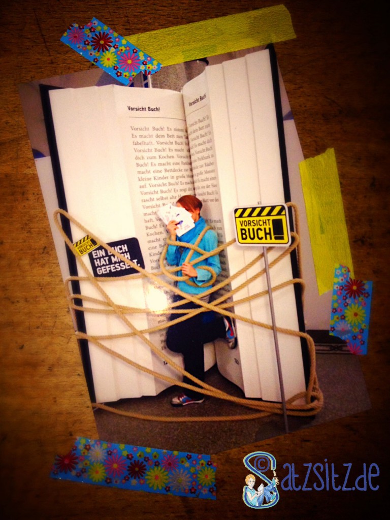 Stuttgarter Buchwochen 2013: das A&O steht in einem übergroßen Buch und ist von einem Seil "gefesselt"